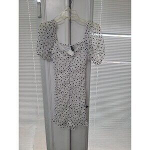H&M draped tulle mini dress features a white mesh fabric with a black polka dot